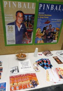 The flyer table at Pinball Expo, with seasonal Dutch candy, free sample Issues and Pinball Magazine cover posters.