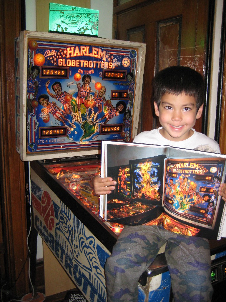 Nate with book on Harlem Globetrotters